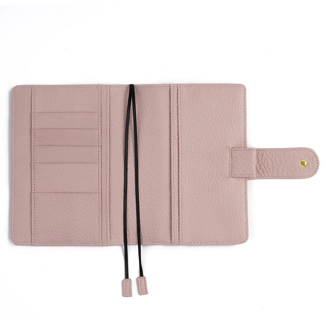 Close-up of a hand-embossed lychee pattern on an off-white A6 cowhide leather notebook with loose-leaf binding.