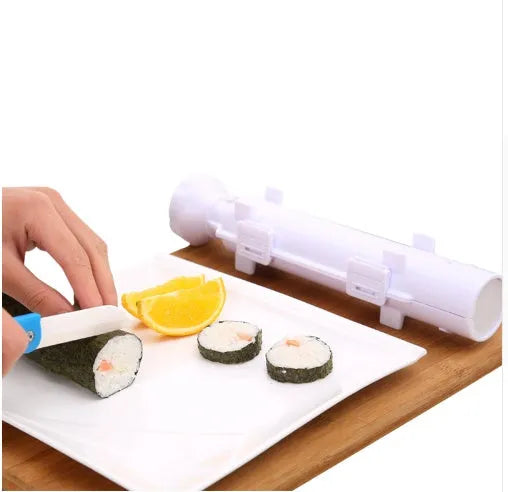 White plastic sushi roll mould kitchen tool on a kitchen counter.