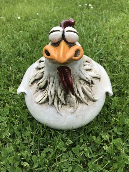 Resin chicken garden ornament with vibrant colours and charming design, adding whimsical appeal to outdoor British garden display