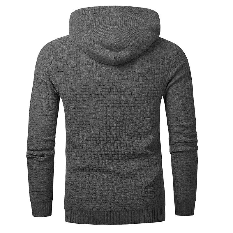 A man wearing a cotton-polyester blend hoodie available in nine colours including black, navy, and red.