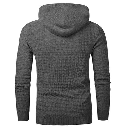 A man wearing a cotton-polyester blend hoodie available in nine colours including black, navy, and red.