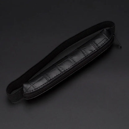 Long beige grey PU leather pencil case on a desk with pens
