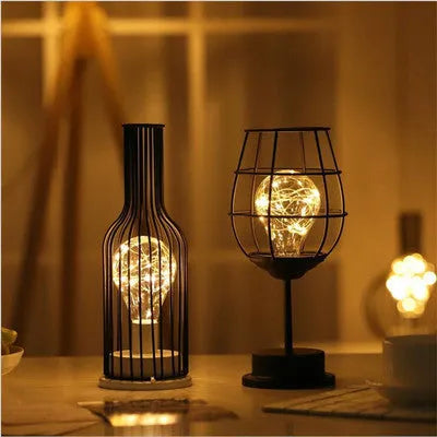 Minimalist wrought iron table lamp shaped like wine bottle with warm white LED light