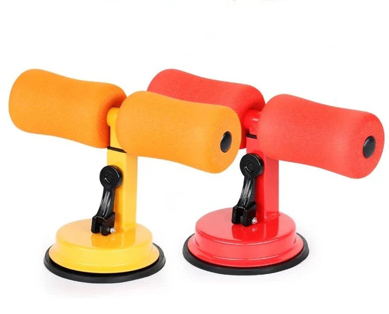 Compact sit-up strength trainer with steel springs and foam padding for home fitness