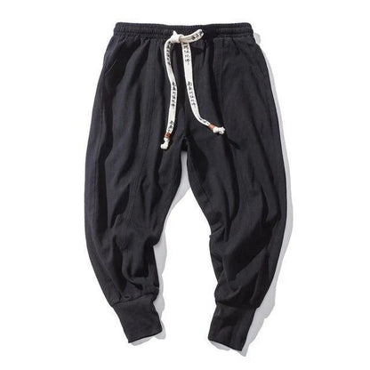 Men's harem trousers made of soft cotton and linen, featuring an elastic waistband and relaxed silhouette for all-day comfort.
