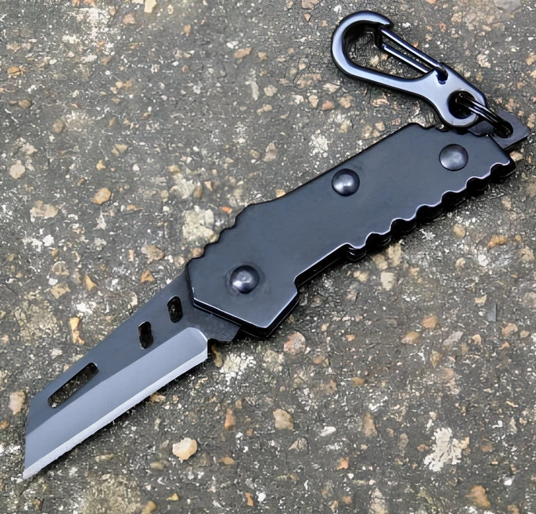 Black pocket folding knife with serrated blade, shown open at 85mm length and closed at 5mm thickness