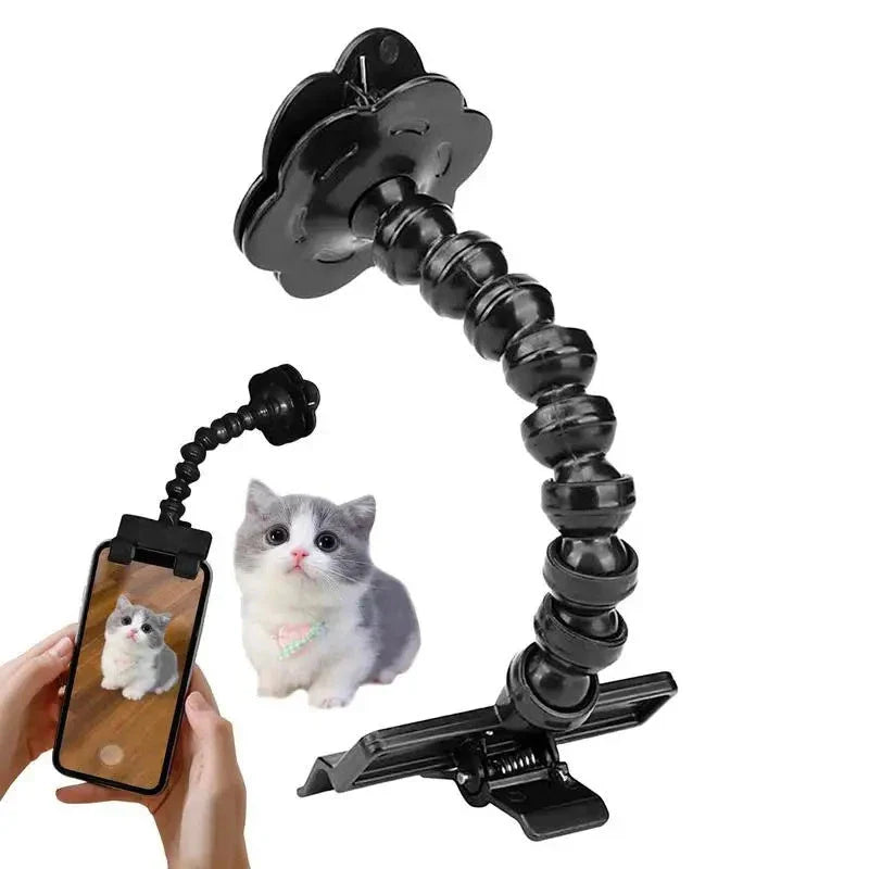 Multifunctional pet camera holder and selfie clip that securely attaches to your phone or mobile device and allows you to capture your furry friend's most playful moments with ease.