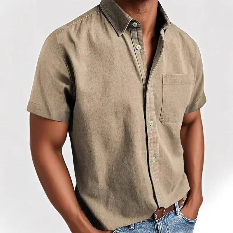 Man wearing a grey loose-fit short sleeve cardigan style shirt