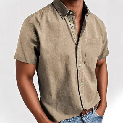 Man wearing a grey loose-fit short sleeve cardigan style shirt