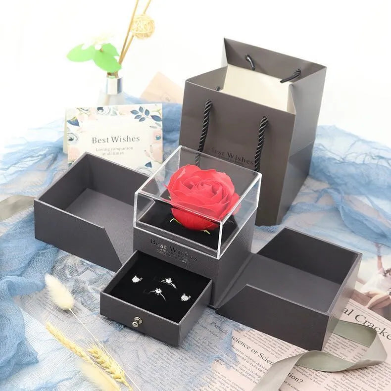 Cardboard jewellery gift box with inner packaging compartments, shown in pink colour.