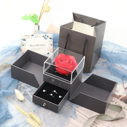 Cardboard jewellery gift box with inner packaging compartments, shown in pink colour.
