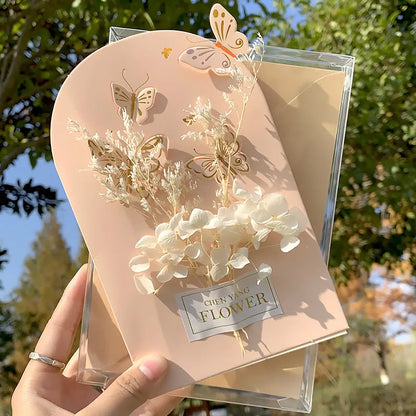 Handmade 3D butterfly greeting card with stand-up artificial flowers on coated paper, 16x10.5cm
