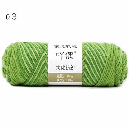 Eight strands of gradient milk cotton wool in a ball, showing multiple colour options for hand knitting.