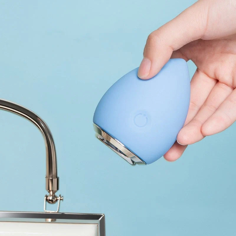 Electronic Cleansing Egg in pink and blue, compact beauty tool for deep skin cleansing