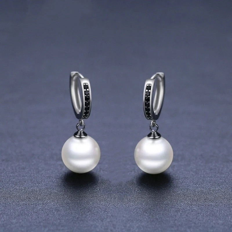 Stylish black round ball stud earrings for women, minimalist design, durable copper construction.