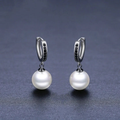 Stylish black round ball stud earrings for women, minimalist design, durable copper construction.