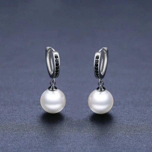 Stylish black round ball stud earrings for women, minimalist design, durable copper construction.