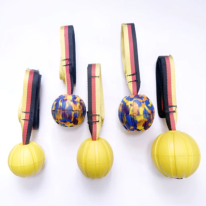 Yellow and camouflage coloured EVA foam floating dog balls with strings in 6.5cm, 7cm, and 9cm sizes.