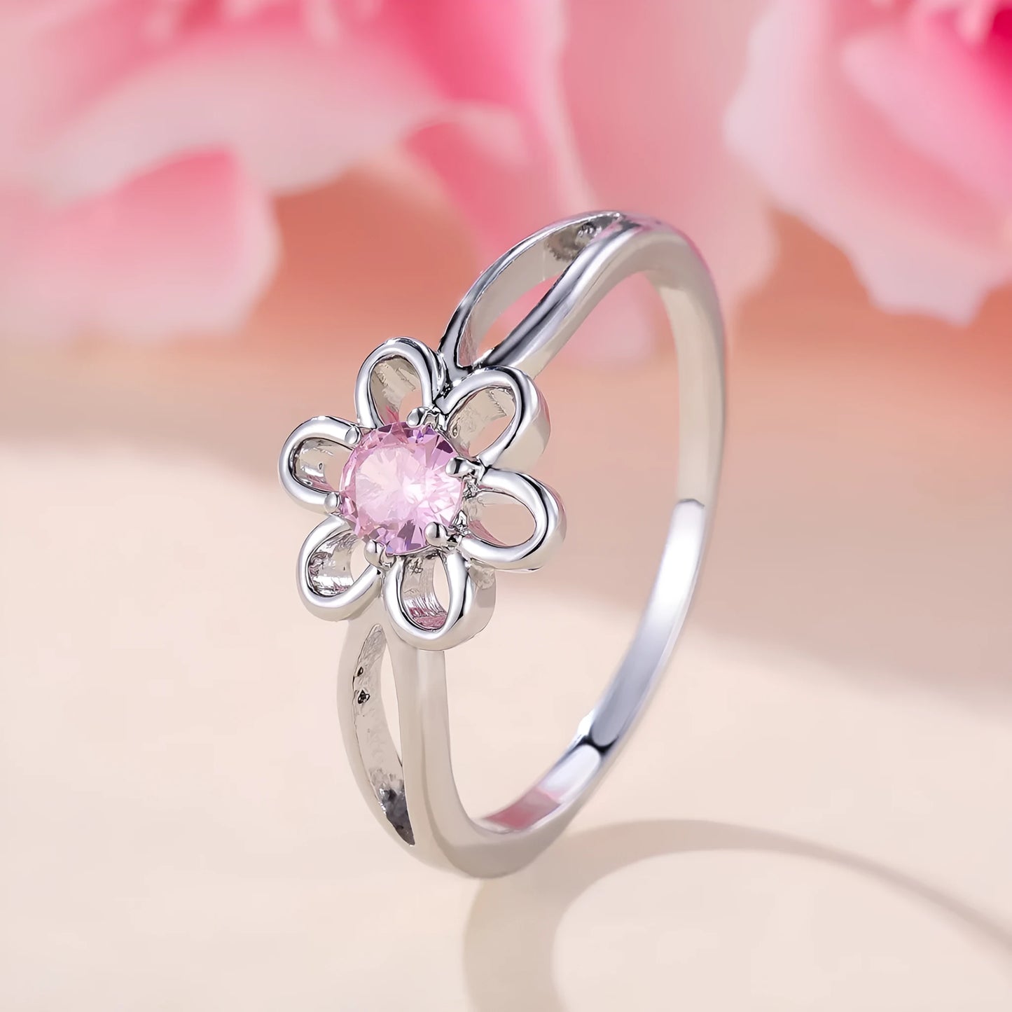 Women's flower hollow ring in pink diamond colour with floral design on copper band