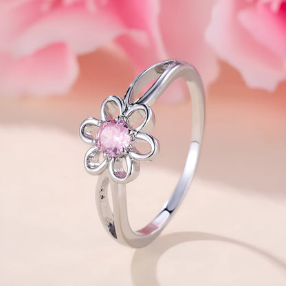 Women's flower hollow ring in pink diamond colour with floral design on copper band