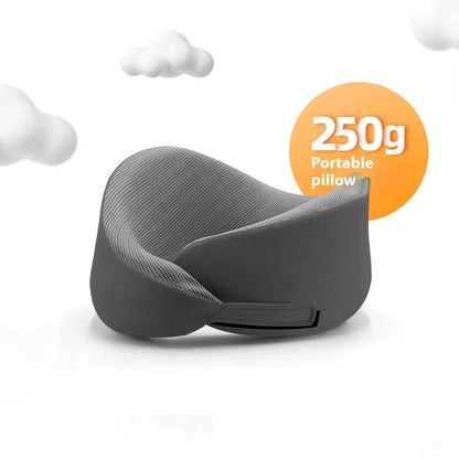 Light grey memory foam U-shaped neck pillow with a magnetic cloth protector.