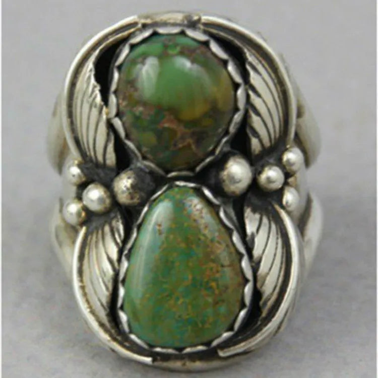Turquoise geometric women's ring with inlaid detailing on alloy band, showing electroplated finish and structured design