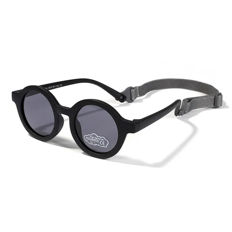Children's round-frame polarised sunglasses with soft TPEE frame for ages 0-3, shown in assorted colours.