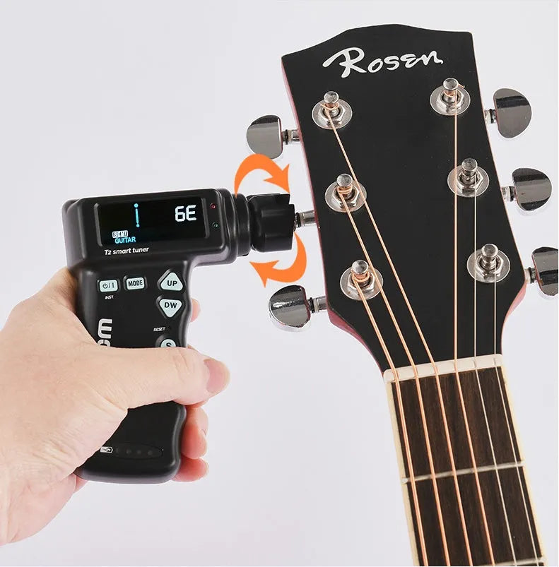 Black and white smart guitar tuner with LCD display and built-in string winder, 11cm width
