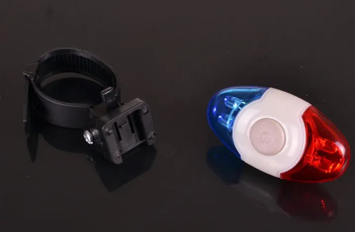 Red and blue LED tail light with adjustable mounting base shown in horizontal and vertical positions.