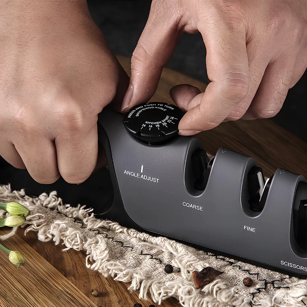 Grey-black manual sharpener with adjustable mechanism for knives and scissors measuring 265x70x45mm