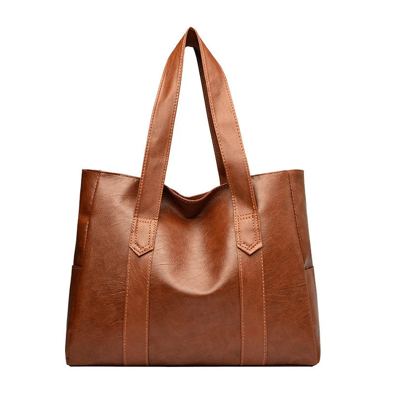 Stylish large capacity commuter shoulder bag in brown and black, perfect for autumn and winter fashion.