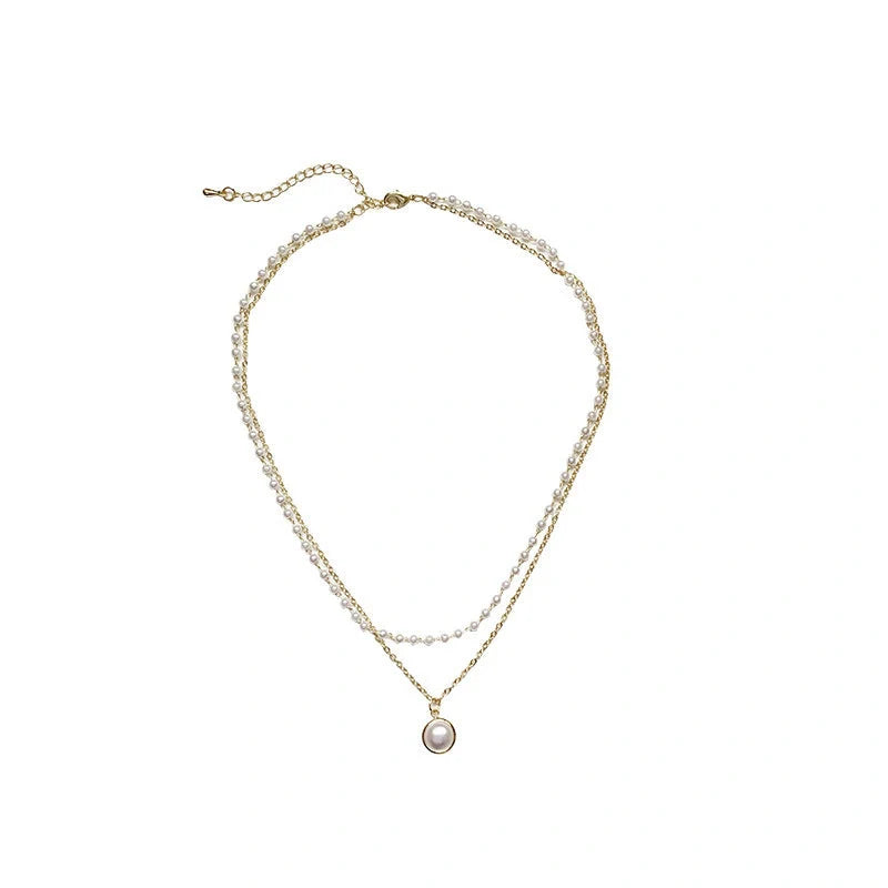 Elegant double-layer pearl necklace for women in gold, showcasing sophisticated design and high-quality craftsmanship.