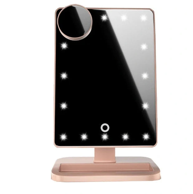 Pink touch screen makeup mirror with LED lights and Bluetooth speaker showing 10X magnification section