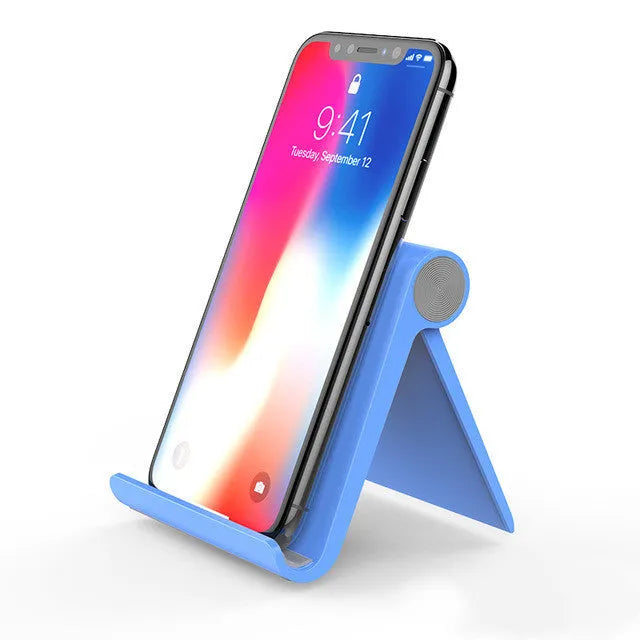UGREEN LP106 adjustable lazy bracket phone holder in black, blue, or white, gripping a smartphone.