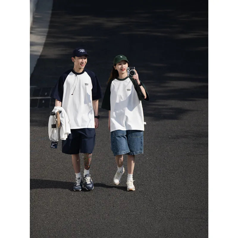 Men's blue loose-fit Japanese style long sleeve t-shirt with raglan sleeves on a hanger.