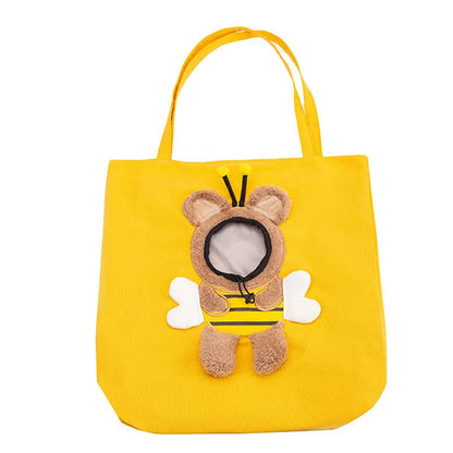 Little Bee Design blue canvas pet carrier bag with animal pattern, showing adjustable side opening for a pet's head.