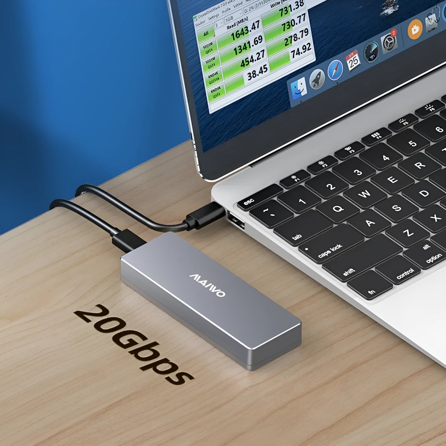 Silver aluminium M.2 SSD external enclosure with USB-C cable, screwdriver, screws, and silicone thermal pad on a desk