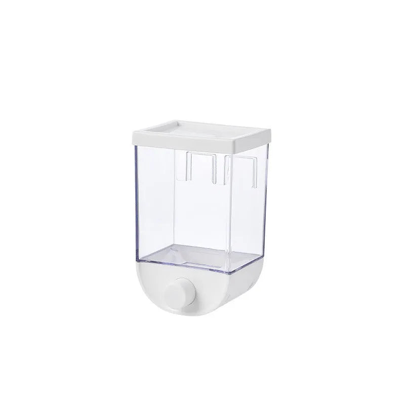 White wall-mountable kitchen food storage box with press lid dispenser, showing transparent body with cereal inside.