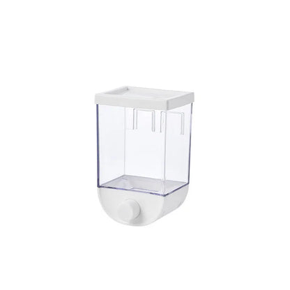 White wall-mountable kitchen food storage box with press lid dispenser, showing transparent body with cereal inside.