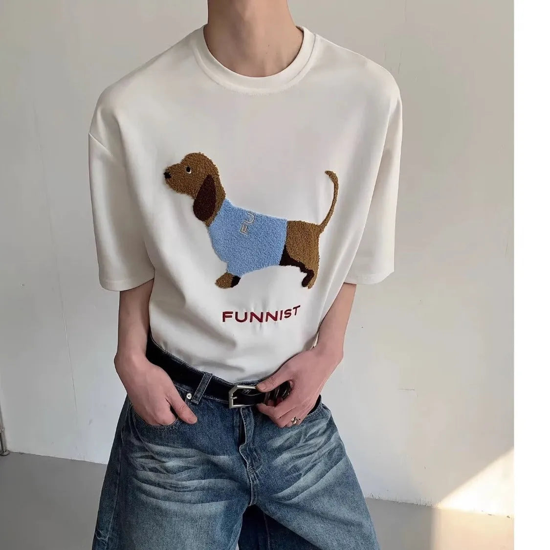 Men's black cotton T-shirt with embroidered sausage dog wrapped in a towel design