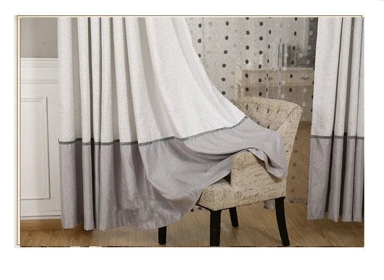 A single blackout curtain panel hanging, demonstrating its dense, light-blocking fabric and neat drape.