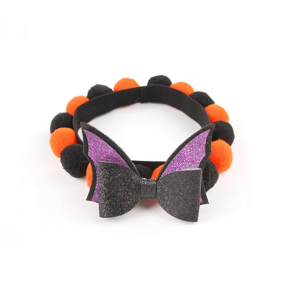 Halloween pet collar with fur ball decoration in pumpkin design