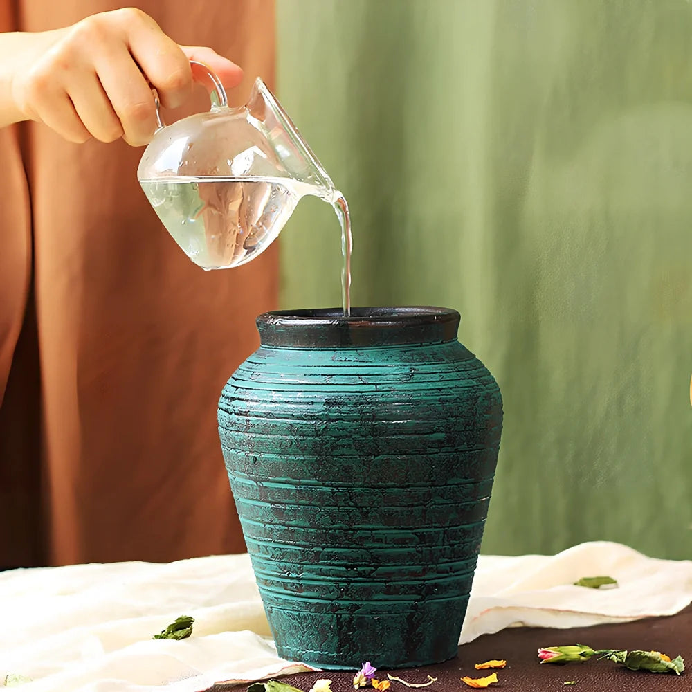 Ceramic mosaic vase with dried flower arrangement, handcrafted surface detailing