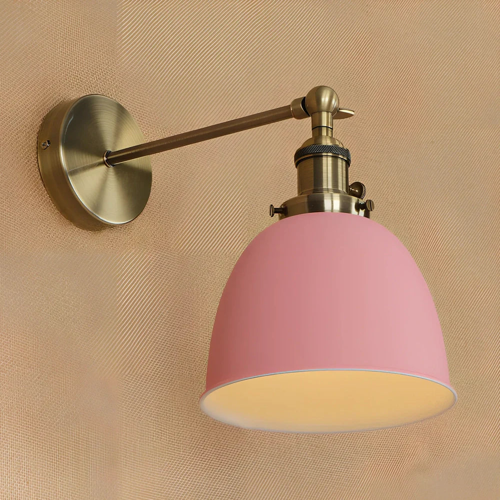 Bedroom wall light with 15cm wide iron shade in pink colour, mounted 20cm projection for soft illumination