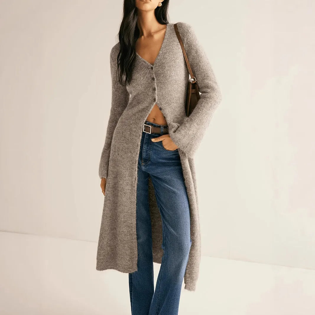 Khaki coloured women's long sleeve button-front cardigan coat on a hanger.