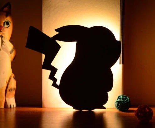 Charming pet-inspired mood lamp with various animal-shaped designs, including walking cat, mother and child cat, licking cat, and Pikachu