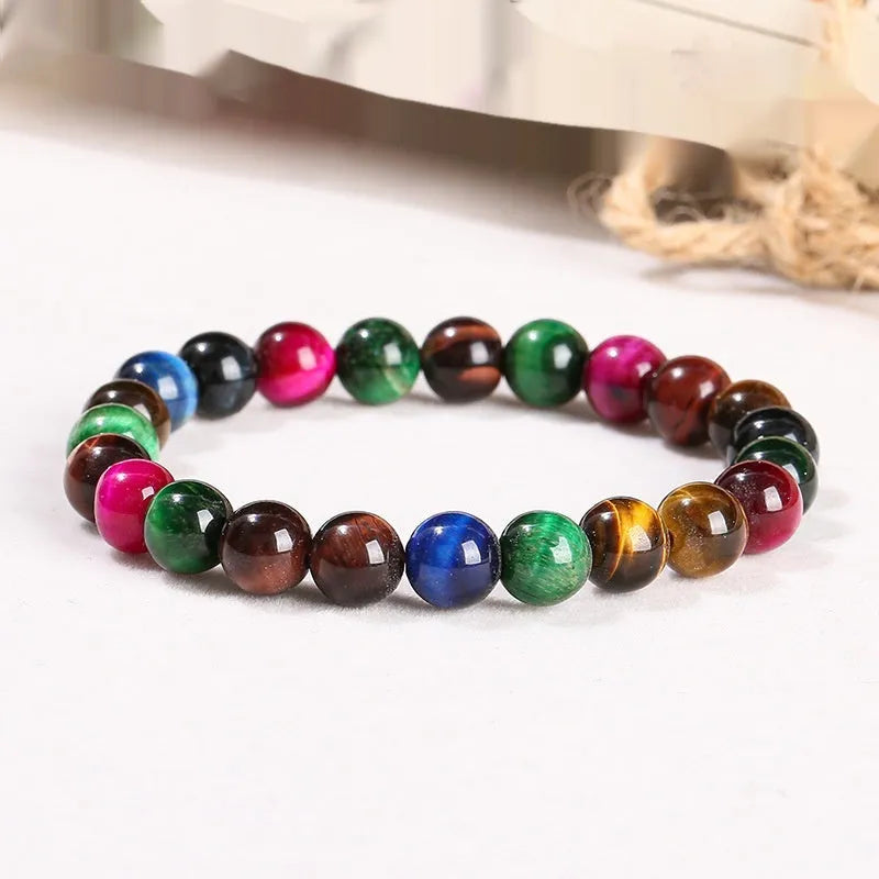 Colourful tiger-eye gemstone bracelet with round beads in 6mm, 8mm, 10mm, and 12mm sizes on mixed string