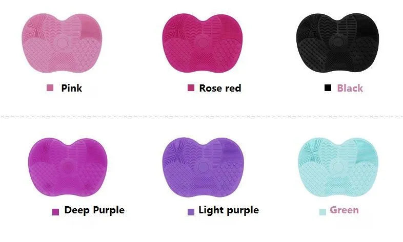 Silicone makeup brush cleaning pad, 15.5 x 12 cm, shown as a coloured brush cleaner mat for cleansing makeup brushes.