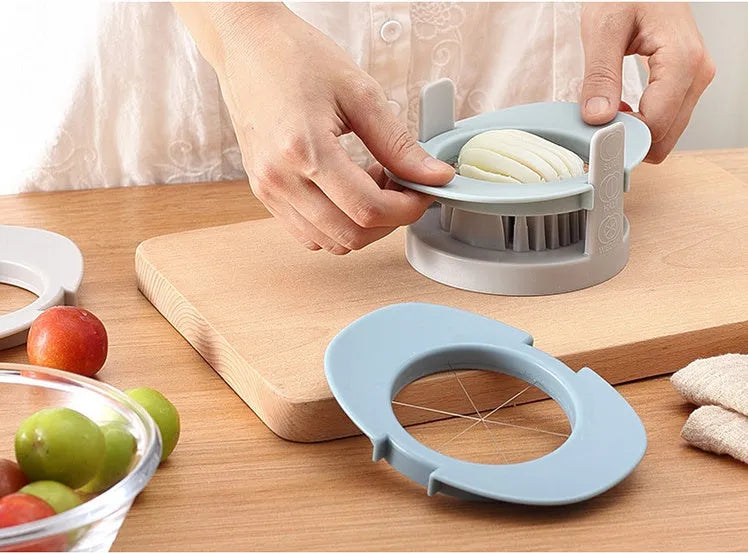 Three-function manual egg cutter in blue with stackable design for kitchen use