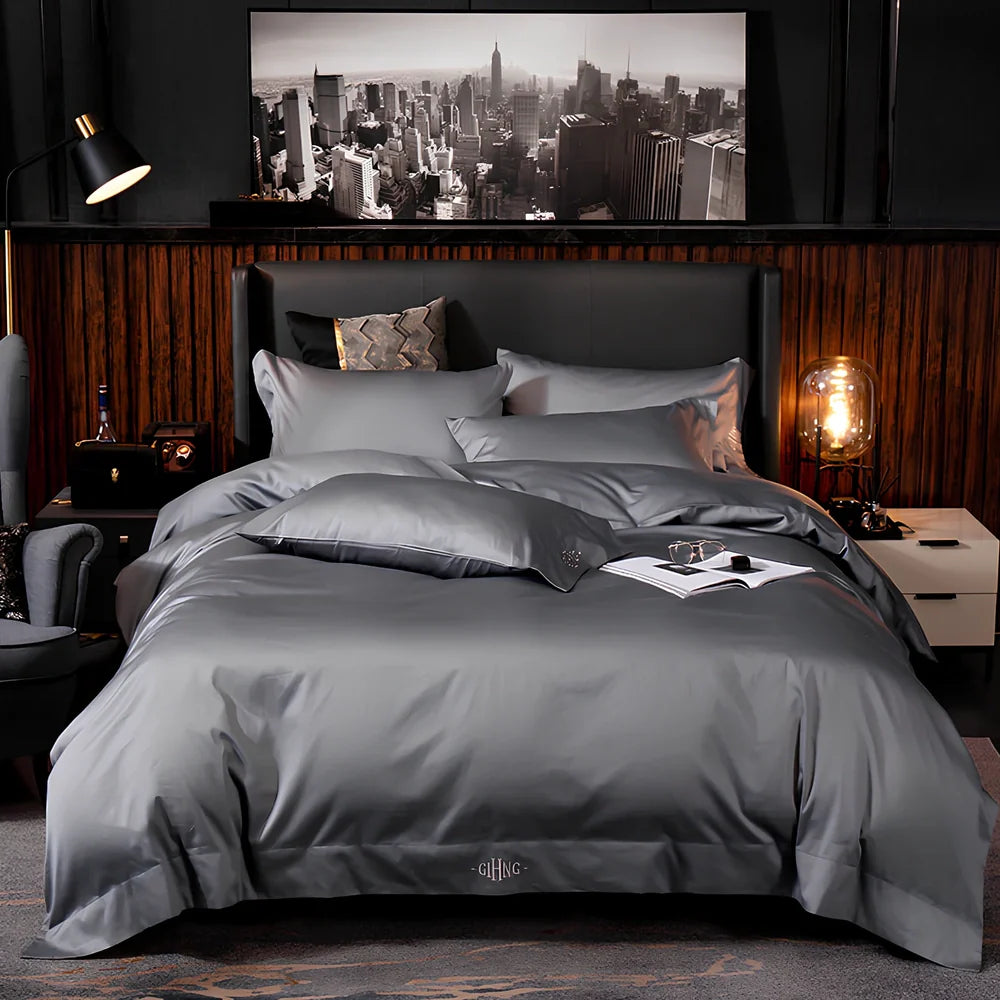 Four-piece cotton bedding set with satin weave fabric showing quilting detail and colour options